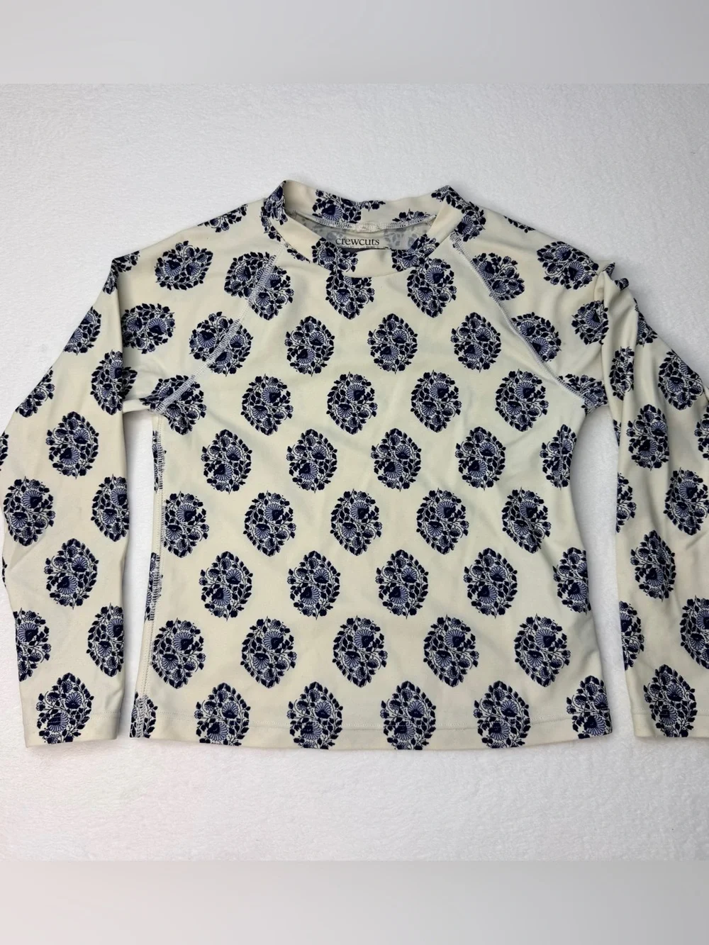J.Crew long-sleeve rash guard featuring an all-over navy and white floral 6-7